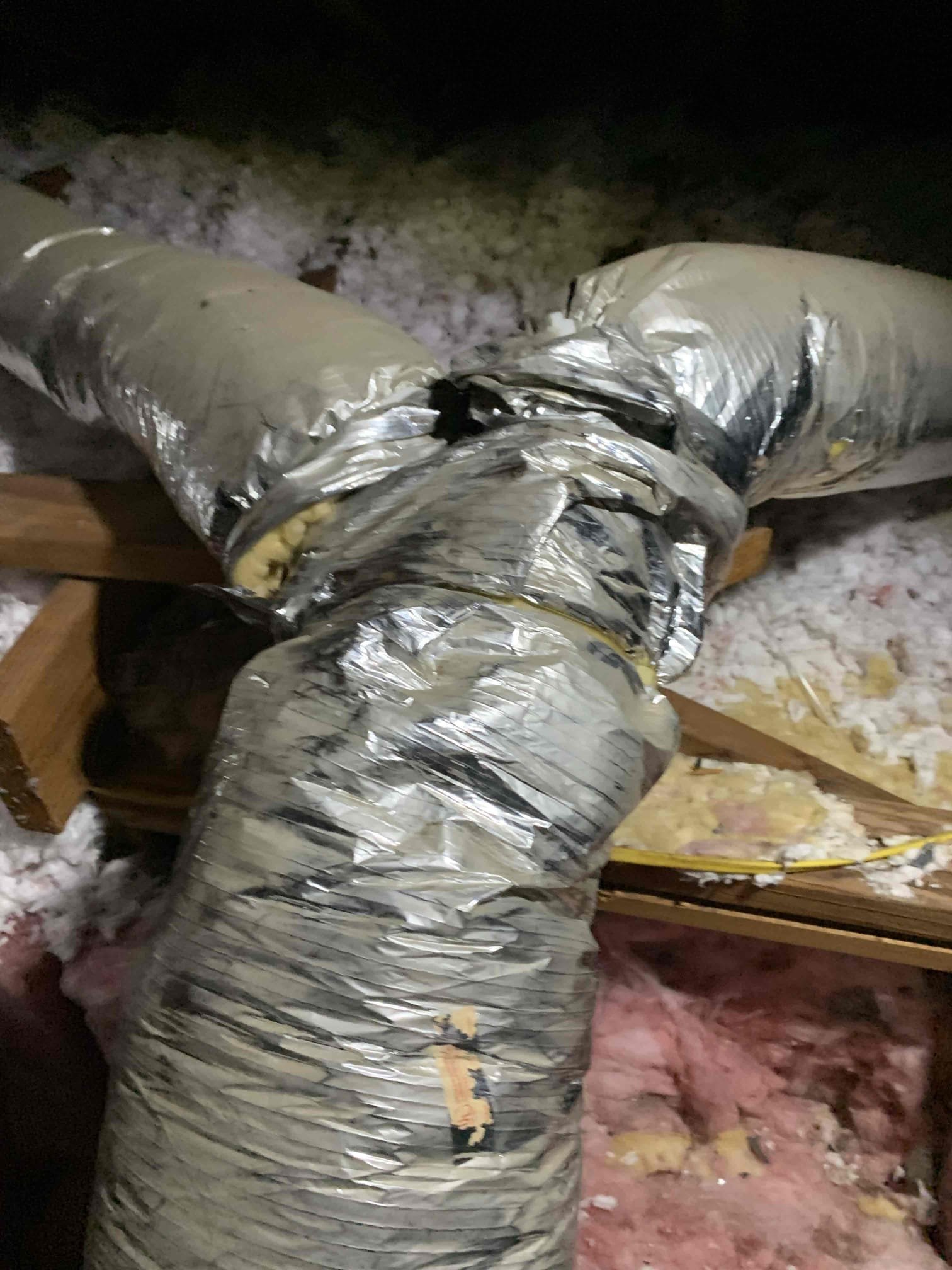 Customer had concerns about uneven cooling in the house. Checked supply temperture and it was 52°. Went into attic and checked ductwork. Found 1 duct completely disconnected at the Y going into the living room. The other duct going into the living room had over a foot of insulation missing. Found another duct run missing over a foot of insulation as well. Notice a ton of air leaking from plenum connection into the attic, the tape had almost come off all the way. Insulation in attic is below the rafters, this makes it easy for hot attic air temps to seep into the living space. 

Customer approved repairs to reattaching the ductwork and getting flex fully covered with the insulation. Also sealing around the plenum connection in the attic with tape and air mastic. 