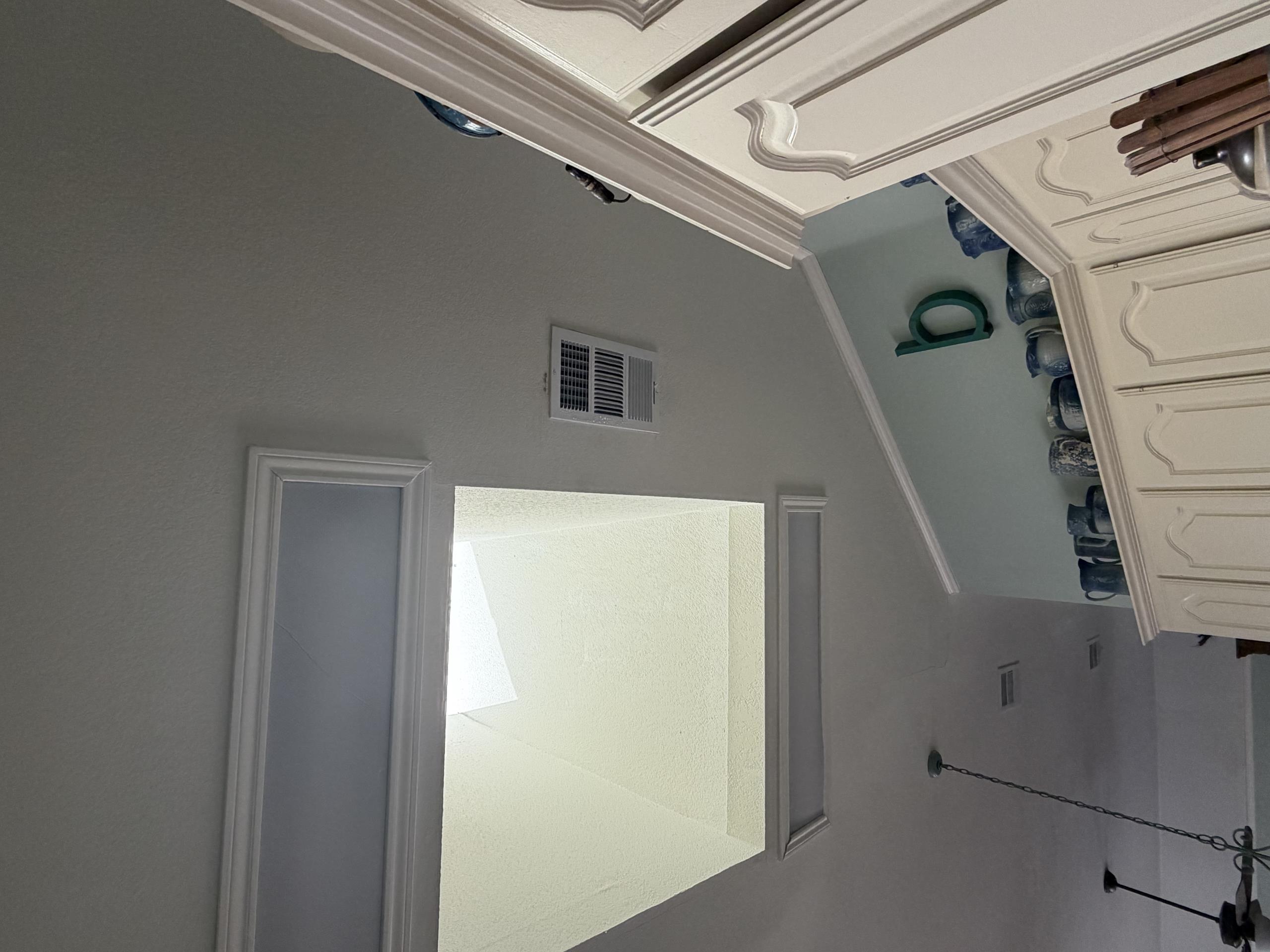Carrollton, TX - The customer has a supply air vent located in the kitchen directly beside a skylight. During inspection, it was determined that heat radiating from the skylight was affecting the supply register. The combination of the hot air around the skylight and the cold conditioned air from the supply vent was causing condensation (sweating) to form on the supply grille.

To help correct the issue, I adjusted and redirected the supply airflow across the ceiling and away from the skylight. This prevents the conditioned air from interacting directly with the concentrated heat coming from the skylight.

By diverting the airflow farther across the ceiling, the temperature difference around the supply register should be reduced, which should eliminate or significantly reduce the sweating/condensation on the supply grille.

Work Performed: Adjusted the supply register airflow direction to improve air distribution and address the condensation issue.