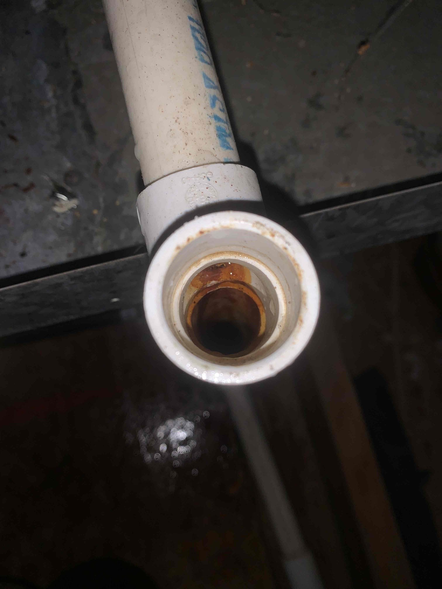 Frisco, TX - Customer had water draining outside from secondary line. Found that system had primary drain line clogged. Drain goes to sink in master bedroom. Covered sink drain to prevent debris coming out. Blew out primary drain line at coil using nitrogen. Poured water down drain to verify it was clear. System is cooling at this time. 