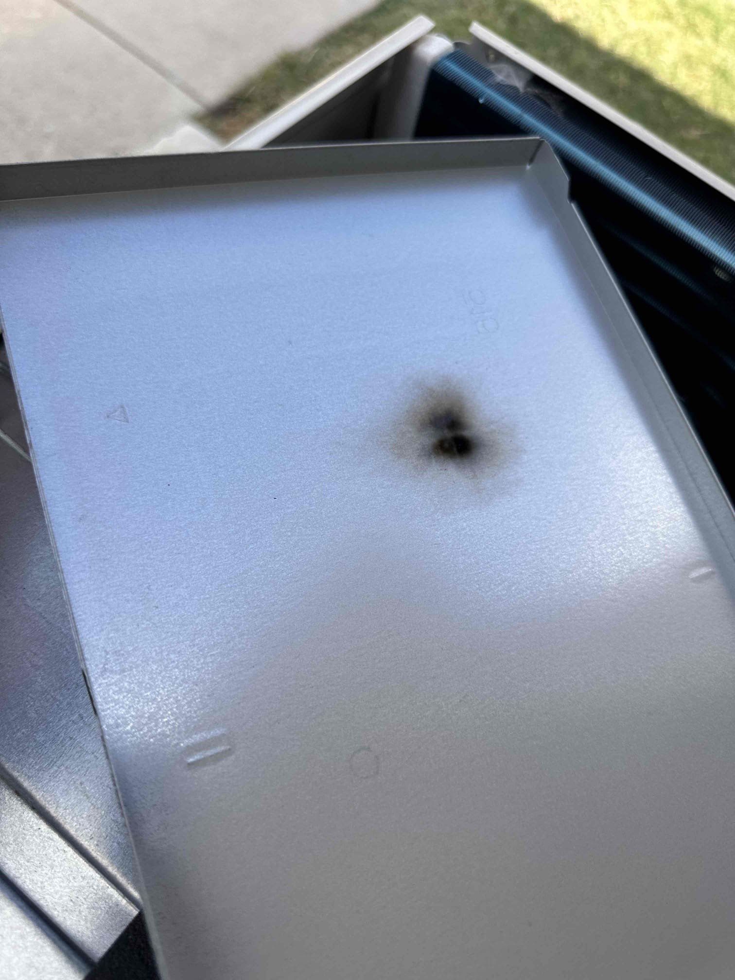 Van Alstyne, TX - No cool on mini split serving garage area. Set thermostat to cool. Indoor blower came on and compressor was running but fan motor would not work. Took covers off to reveal circuit board. Found board burnt where it had arched and even left a black mark on cover above it. Need to replace circuit board under parts warranty. 