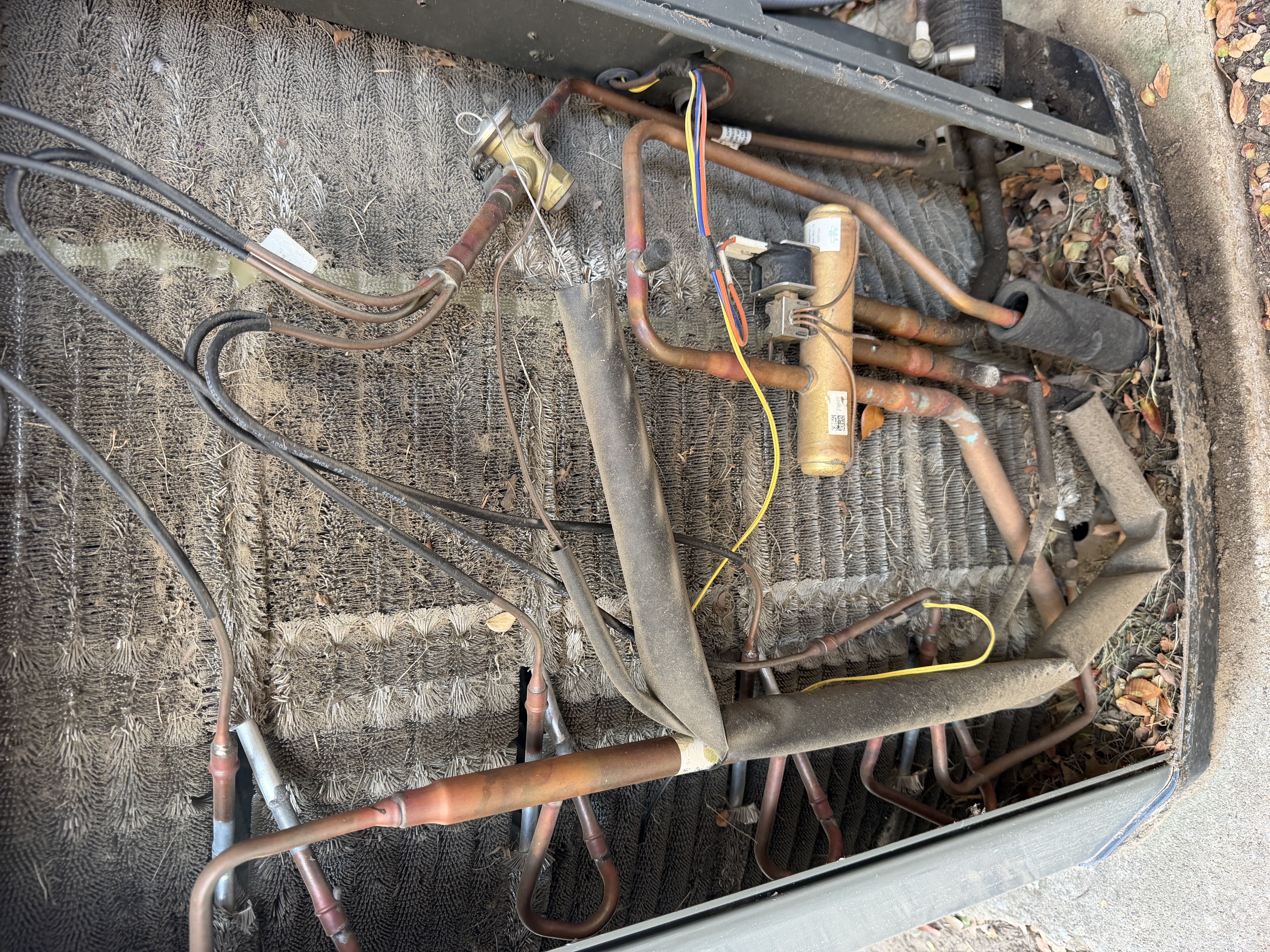 Dallas, TX - Service Summary

Upon arrival, we evaluated the reported condensation/water leak above the bathtub.   System was running at 72°.

Findings / Root Cause

Our inspection determined that the primary cause of the condensation leak was a significant buildup of slime, dirt, and debris inside the HVAC condensation drain pan and drainage area.

The system’s air filter is located in the wall, leaving an open area between the filtration point and the HVAC unit. Dirt, dust, and other debris can collect in this space and eventually make its way into the unit and condensation pan.

Over time, this debris mixed with moisture and created slime and buildup inside the drain pan, restricting proper drainage. Once the condensation could no longer drain properly, water backed up and resulted in the leak observed above the bathtub.

*********Did a courtesy condenser coil cleaning.************

Recommended Preventive Maintenance

To help prevent this issue from returning, we strongly recommend:

* Chemical 