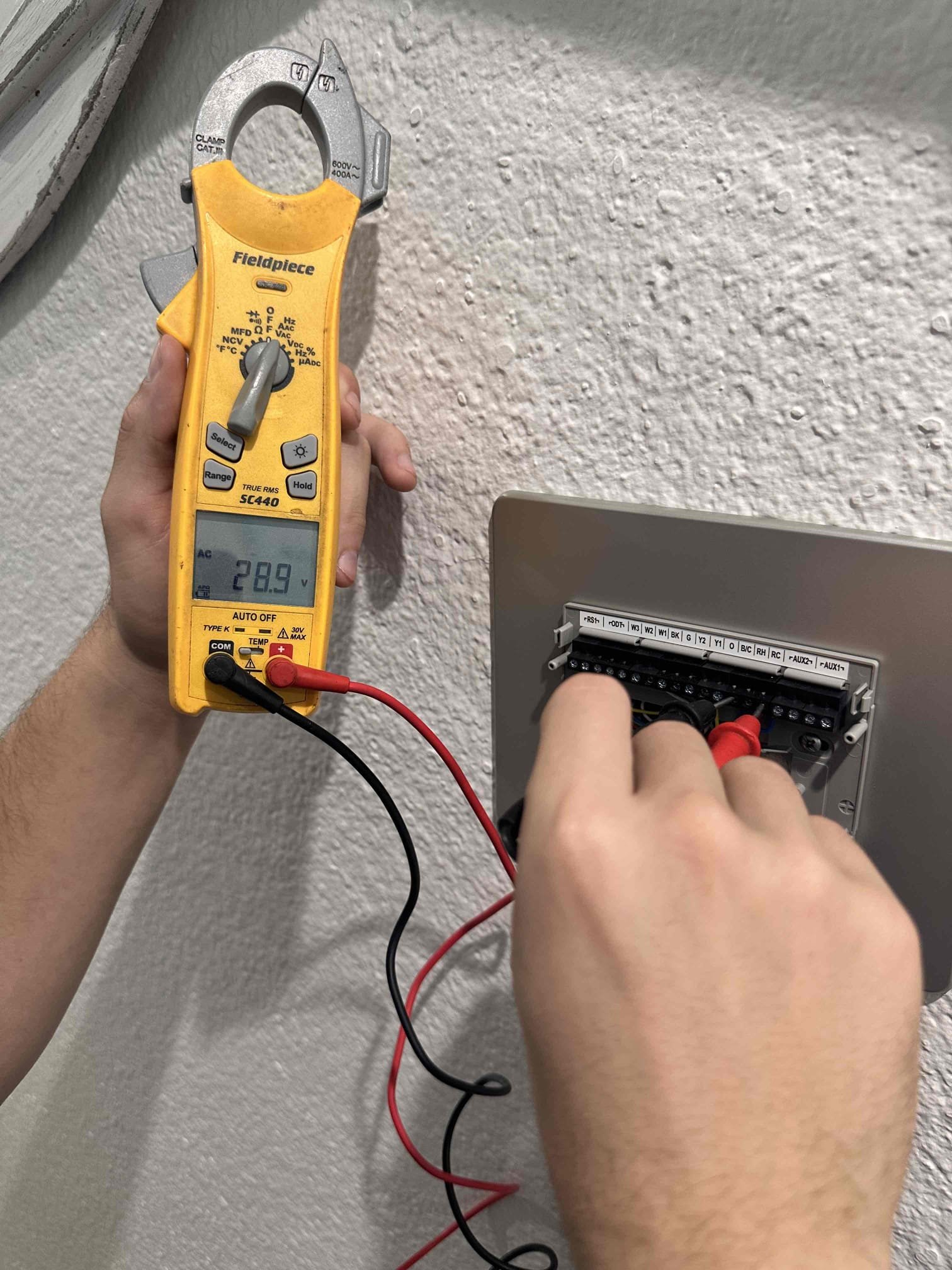 Pottsboro, TX - Arrive for no cool on single system house. Customer stated that it was running fine until Sunday and then it stopped cooling. After they left it off for a day and tried it again, it came back on like normal. Checked wiring to unit. Found that when I moved the wires around, the thermostat would restart. The common wire inside the air handler was not connected tightly and it came out of wire nut. Fixed wiring and tested system. The first time I turned it on, the blower motor did not turn on with the rest of the system. Capacitor for blower is out of acceptable range, this could have caused the blower to not come on. Replaced capacitor for motor. Tested system after repair and everything came on and cooled properly. Tested amp draw on blower motor. System is cooling at this time. 

Also performed heating maintenance. System is electric heat only with straight AC condenser. Set thermostat to heating and checked amp draw on electric heat strips. All heating elements are running. Measured te