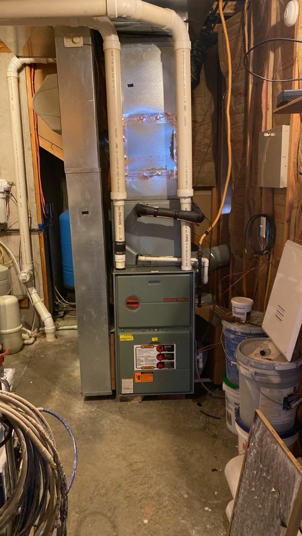 Maintenance on 2 Ruud gas furnaces