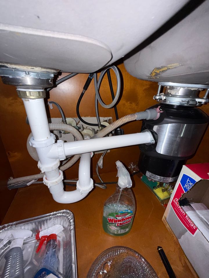 Work Performed:
	•	Removed entire waste bends from double bowl kitchen sink
	•	Reason for removal was sinks were not properly trapped
	•	Supplied and installed new waste piping for double bowl kitchen sink including disposal connection
	•	Installed new properly vented trap
	•	Tested drainage and connections for proper operation and no leaks present
	•	Cleaned up work area upon completion.
