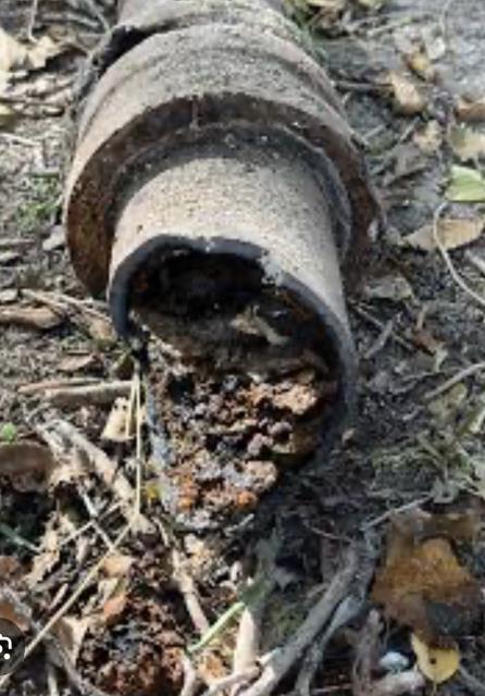 Replace section of old cast iron sewer line at front yard