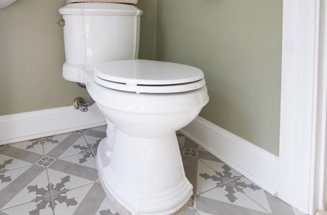 We removed the antique toilet and installed a sleek, modern one. The new fixture enhances efficiency and aesthetics, ensuring a perfect fit and function.