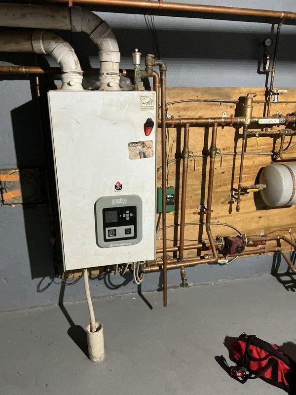 Performed routine maintenance on Prestige residential boiler system and Carrier outdoor AC unit. Inspected all copper piping, valves, expansion tank and connections, ensuring proper operation of the heating system as requested. Cleared debris from around outdoor condensing unit and visually inspected for any external damage or issues.