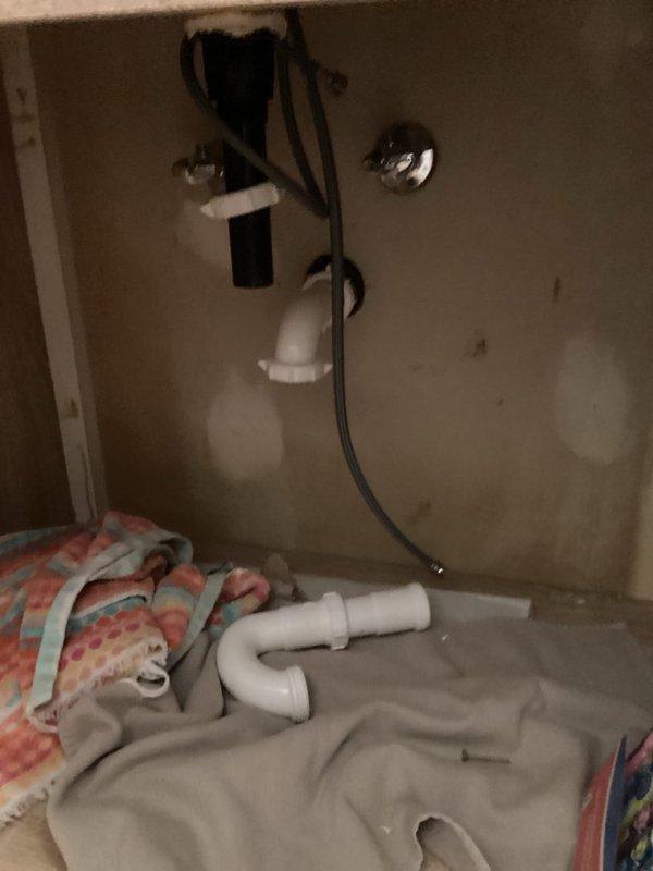 Completed installation of two new toilets, reset one existing toilet, replaced four toilet water valves, and reconnected lavatory vanity plumbing. Used protective drop cloths throughout work area to protect newly refinished floors. All plumbing connections were tested and verified operational.