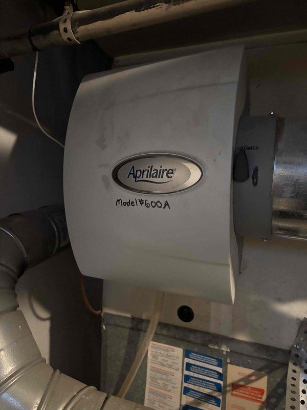 Performed scheduled heating tune-up on customer's system, including inspection and maintenance of one furnace and Aprilaire Model #600A whole-home humidifier. Inspected air filtration system, noting some dust accumulation on the filter mesh. All components functioning properly after service.