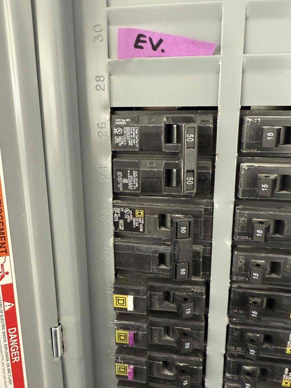 Successfully completed replacement of client's Enel X Juicebox charger with new Emporia EV charger. Installed unit using existing 60A circuit and flexible metal conduit to extend from junction box to new charger. Installation was hardwired properly, but customer Wi-Fi connection setup remains pending as account credentials were unavailable during service.
