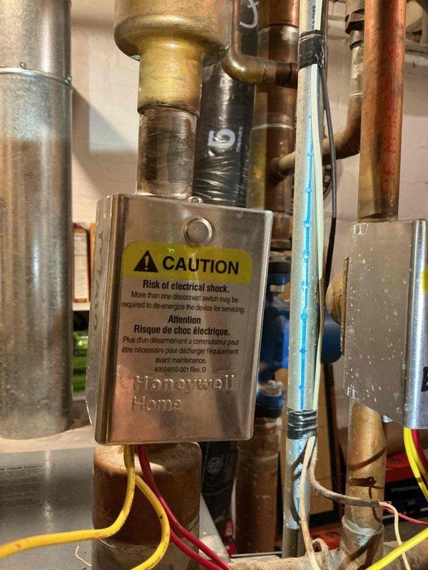 Diagnosed and replaced faulty zone power head valve causing thermostat and heat issues. Found valve lever loose and unresponsive despite proper 24V signal, preventing zone valve operation. Replacement restored proper heating system functionality.