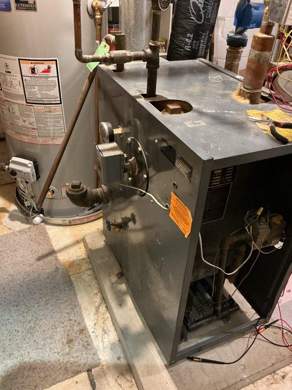 Diagnosed and replaced faulty zone power head valve causing thermostat and heat issues. Found valve lever loose and unresponsive despite proper 24V signal, preventing zone valve operation. Replacement restored proper heating system functionality.