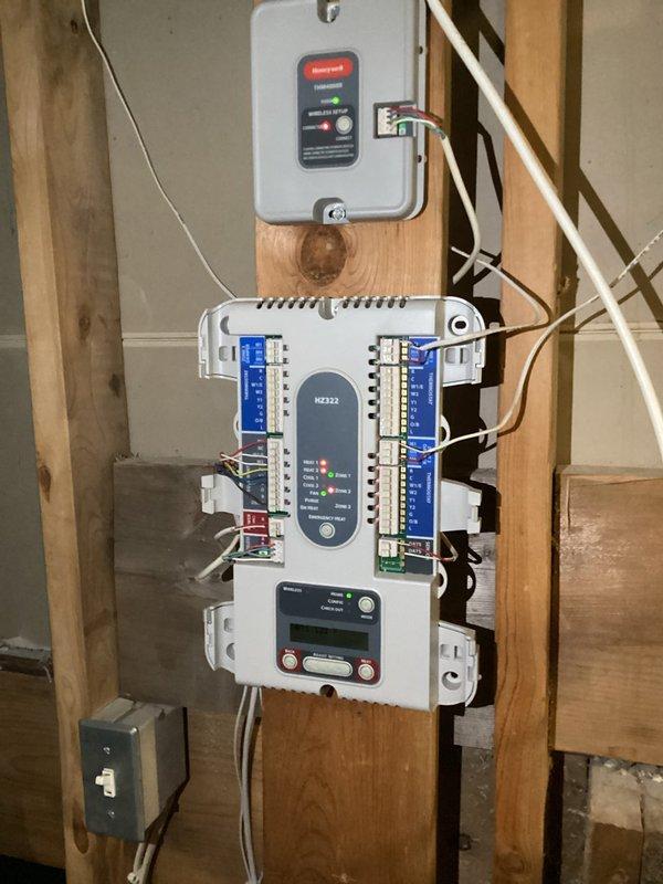 Diagnosed temperature inconsistency in dual-zone system caused by loss of power to zone dampers. Replaced failed Honeywell zone controller module to restore proper functionality to 10-year-old furnace system.