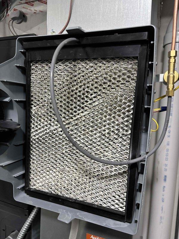 Completed routine heating maintenance on customer's system which includes a boiler, HRV, gas fireplace, and Aprilaire 600 Series humidifier. Inspected all components for proper operation and replaced the humidifier filter pad as part of the scheduled service. Customer was not present during visit; left voicemail and text message to reschedule remaining portions of maintenance.