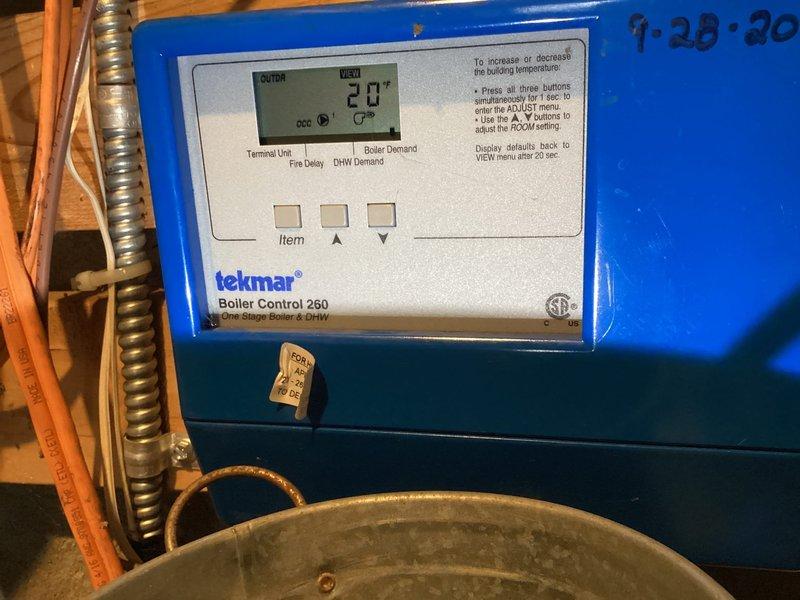 Inspected boiler system with reported intermittent zone control issue. Observed Tekmar 260 control panel functioning normally, showing proper temperature readings. Examined zone valves and associated piping; system was operating correctly during service visit with all zones responding properly to thermostat commands. No intervention required as all components were functioning within parameters at time of inspection.