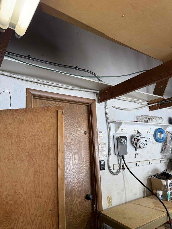 Successfully installed and programmed customer-supplied Charge Point EV charger on garage back wall. Hardwired unit at 60 amps (allowing 48 amp output) using surface-mounted conduit, and installed tandem breaker in main electrical panel to accommodate the new circuit. All programming and setup completed during installation visit.