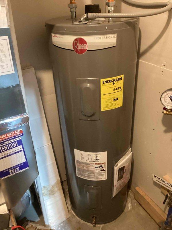 Diagnosed and serviced Rheem Professional water heater with no hot water issue. Inspection revealed a functional top heating element but a severely corroded lower heating element that had failed. Provided customer with information to obtain replacement lower element to restore proper water heater operation.