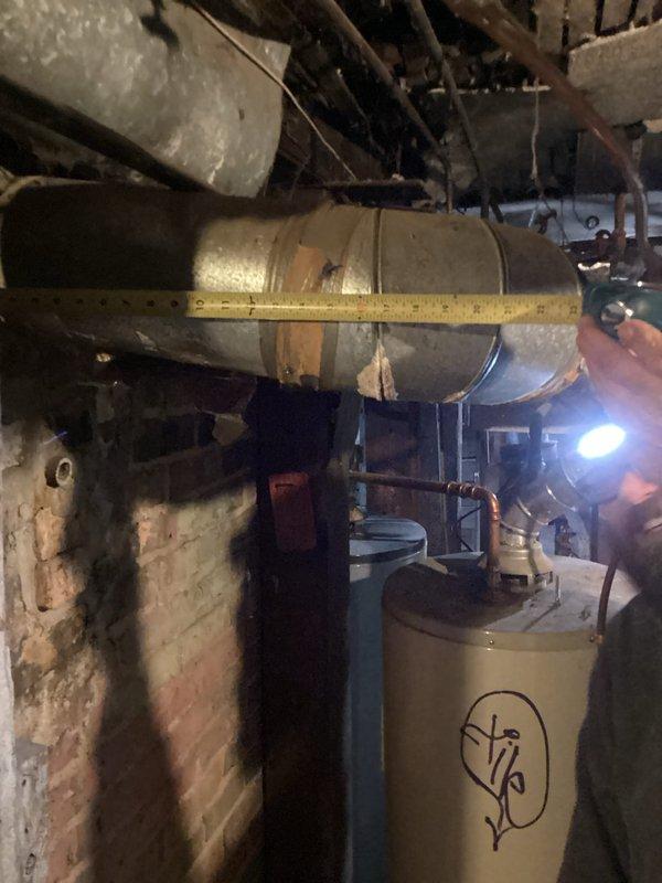 Conducted city mandated safety inspection on boiler system. Replaced defective pressure relief valve and small venting pipe to bring system into compliance with current code requirements. Documented ductwork measurements for future reference as existing ducting may require modifications to meet code standards.