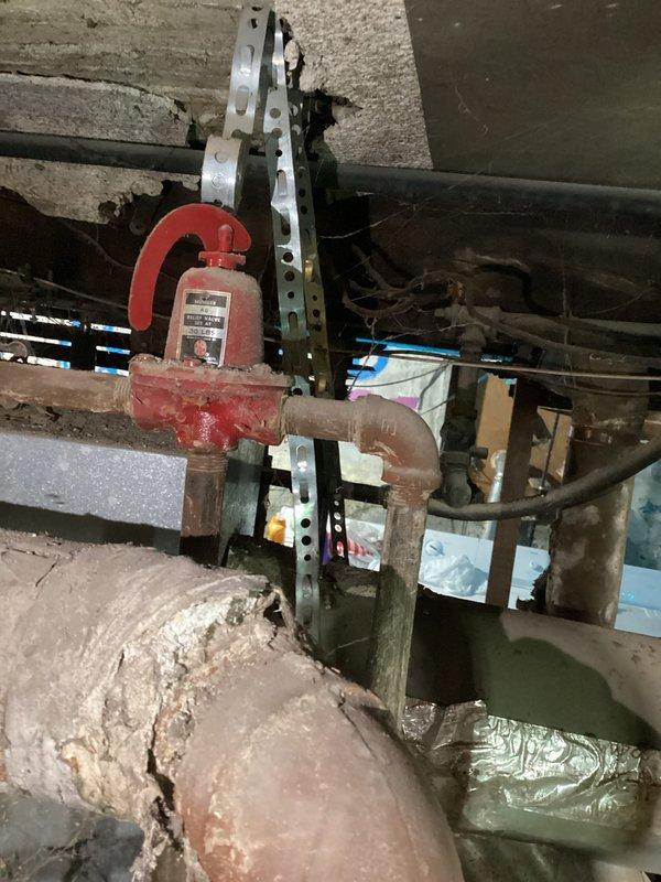 Conducted city mandated safety inspection on boiler system. Replaced defective pressure relief valve and small venting pipe to bring system into compliance with current code requirements. Documented ductwork measurements for future reference as existing ducting may require modifications to meet code standards.