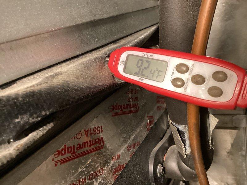 Responded to customer complaint regarding heating system failure and suspected thermostat issues. Performed diagnostic evaluation using Taylor digital thermometer and UEi EM720 meter, revealing extremely low temperature readings (12.4°F) at refrigerant lines with visible frost accumulation. System inspection complete with no repairs required during this preventative maintenance visit.