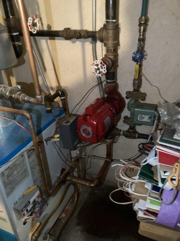 Conducted prepaid heating maintenance visit on customer's boiler system. Inspected the circulation pump (Taco Series 1100) and associated plumbing components including valves and copper piping network. Customer inquiry about radiator drainage was addressed during the service call; system currently operating as designed with no issues found.