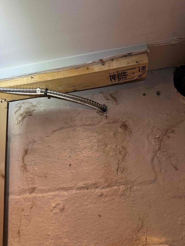 Completed comprehensive electrical work in bathroom renovation, including installation of new vanity light with dedicated switch, bathroom exhaust fan with timer control, and code-compliant dedicated circuit GFI outlet. Removed existing porcelain light fixture and relocated doorbell transformer. Work involved fishing wiring from basement panel through ceiling and crawl space to access bathroom. All installations completed with proper electrical permits and inspections.