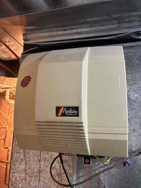 Performed annual heating maintenance on two furnaces, three gas fireplaces, and one Aprilaire whole-house humidifier. Inspected humidifier components and filter mesh, noting some discoloration and dust accumulation consistent with normal operation. All systems functioning properly following service.