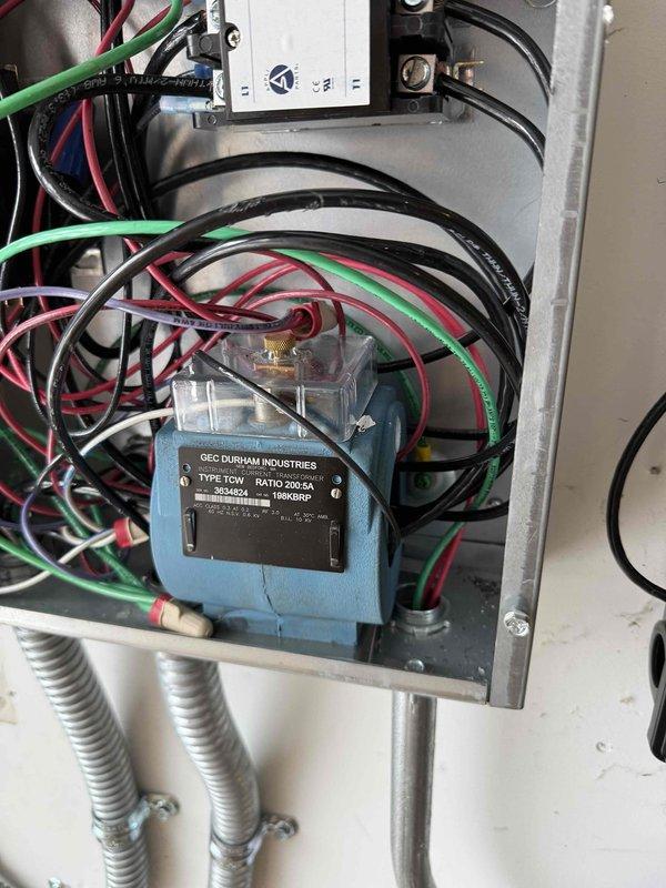 Successfully completed dual EV charging system modification. Rerouted existing Charge Point charger to operate on 240V/20A circuit (16A output) while installing customer-provided Grizzle-E charger on a hardwired 40A circuit (32A output). Reconfigured load management system with existing contactors to maintain proper operation with both charging systems.