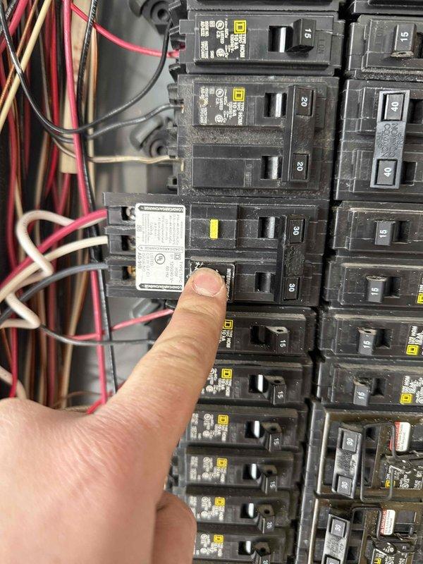 Successfully completed dual EV charging system modification. Rerouted existing Charge Point charger to operate on 240V/20A circuit (16A output) while installing customer-provided Grizzle-E charger on a hardwired 40A circuit (32A output). Reconfigured load management system with existing contactors to maintain proper operation with both charging systems.