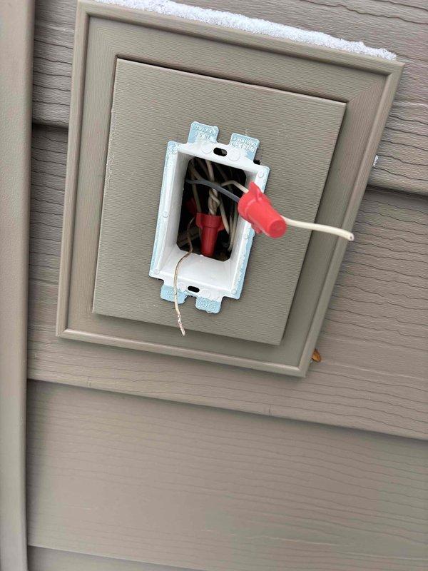 Completed final electrical inspection for siding installation project including verification of 7 exterior light fixtures (including dual-head motion-activated security lighting) and 3 outlets. Confirmed proper installation of exterior outlet boxes and wiring on vinyl siding. Performed quality check on AC unit and inspected meter and mast assembly for compliance with electrical code requirements.