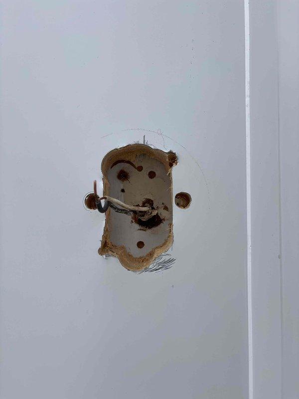 Completed final siding electrical work, installing two exterior light fixtures and one outlet on the residence. Replaced damaged/corroded outlet cover and properly wired new outdoor light fixture to existing junction box, ensuring secure connections with appropriate wire nuts.