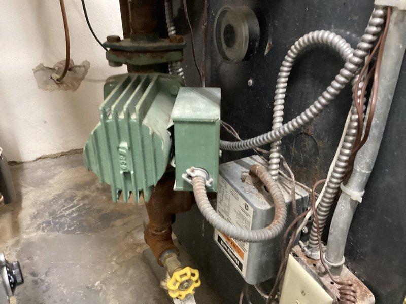 Completed PA heating maintenance on customer's hydronic system consisting of one boiler with circulation pump, one Unico attic air handler, and two gas fireplaces. Inspected system operation with temperature readings at approximately 50°C on Honeywell gauge, verified all components functioning properly, and confirmed no issues with plumbing connections. Plumbing technician also on site during service visit.