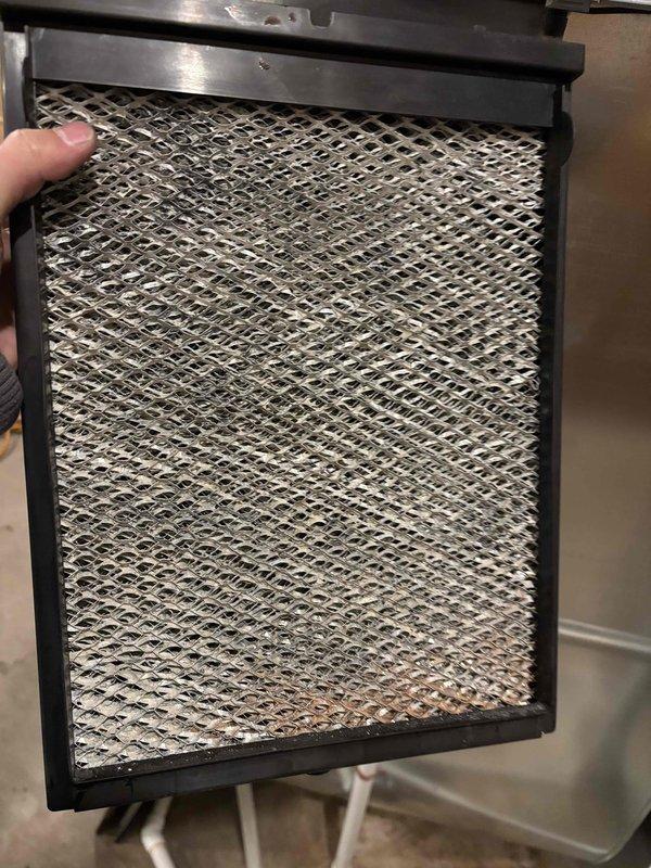 Completed scheduled Prepaid Agreement maintenance visit on two furnaces, two humidifiers, and one GFP. Performed comprehensive heating system inspection and maintenance. Removed and examined air filters, which showed normal accumulation of dust and debris, indicating proper filtration function.