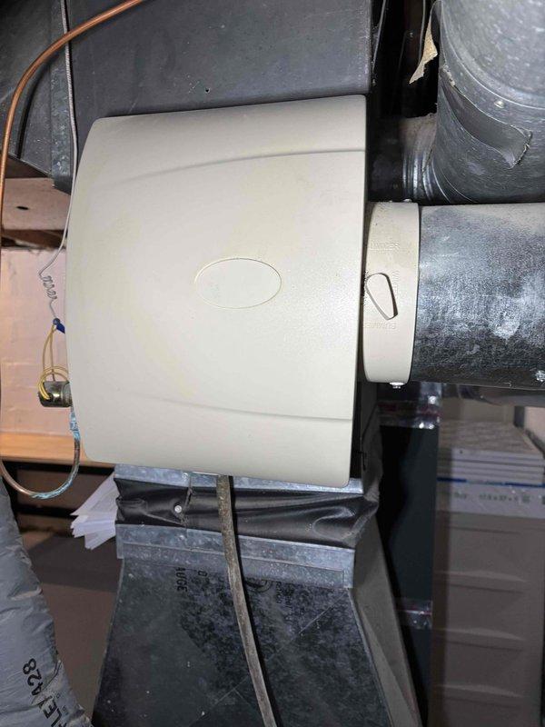 Performed fall maintenance on furnace system and humidifier per prepaid agreement. Inspected humidifier mounted on ductwork and noted normal installation with proper connections. Observed copper water line to humidifier showing oxidation, which is within normal parameters but will require monitoring. All components functioning as designed after service.