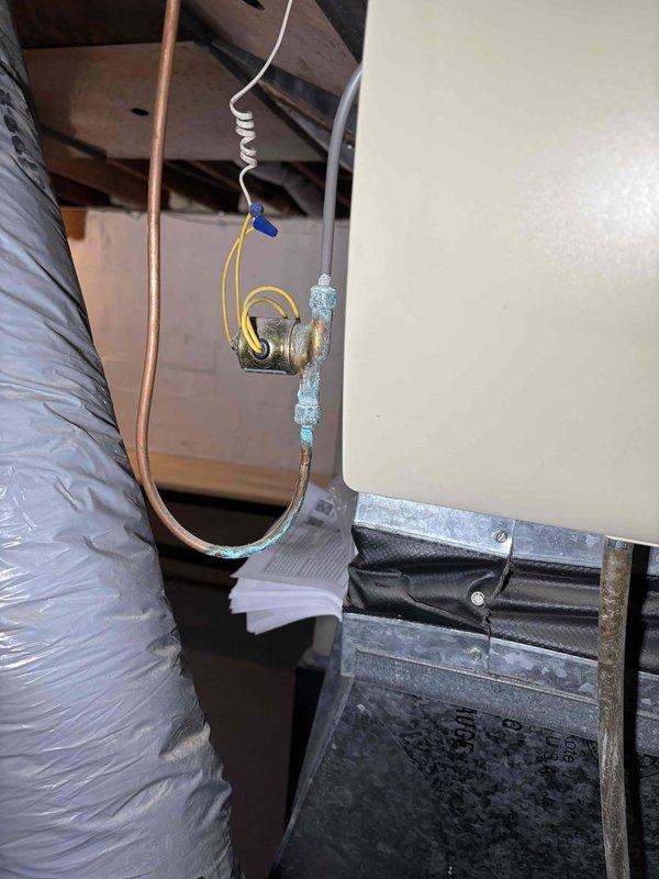 Performed fall maintenance on furnace system and humidifier per prepaid agreement. Inspected humidifier mounted on ductwork and noted normal installation with proper connections. Observed copper water line to humidifier showing oxidation, which is within normal parameters but will require monitoring. All components functioning as designed after service.