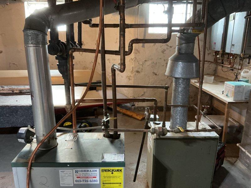 Performed scheduled preventative maintenance on two boilers in the gas-fired heating system. Inspected system pressure gauges and confirmed proper operating range. Cleaned both units, examined flue pipes for proper ventilation, and verified all piping connections were secure with no signs of leaks.