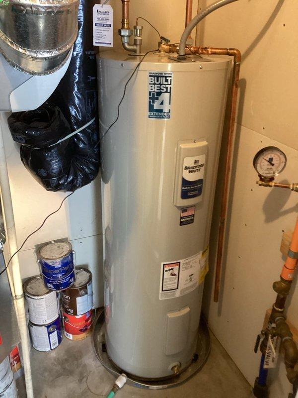 Removed old leaking water heater and installed new Bradford White 50-gallon tall water heater (Model #RE250T6-1NCWW) with copper pipe connections. Customer elected not to transfer the powered anode rod from the old unit to the new installation. Completed all necessary plumbing connections and verified proper operation.