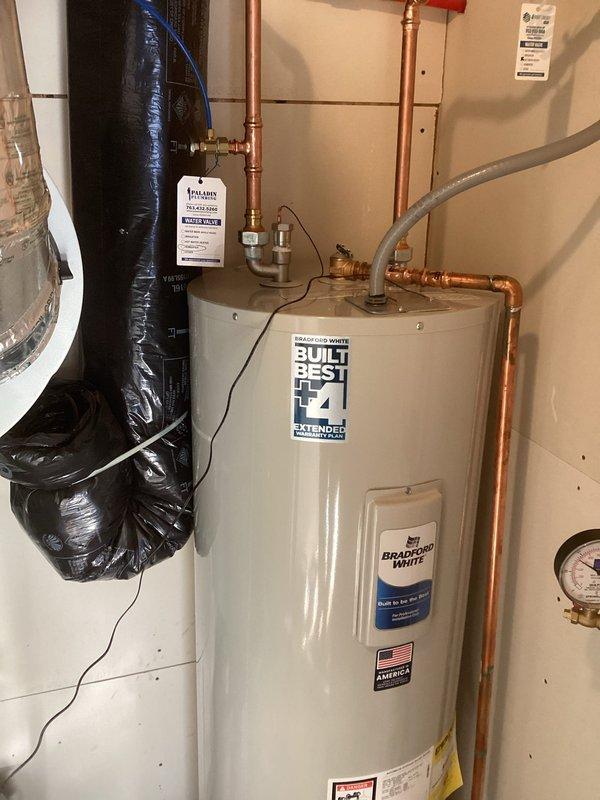 Removed old leaking water heater and installed new Bradford White 50-gallon tall water heater (Model #RE250T6-1NCWW) with copper pipe connections. Customer elected not to transfer the powered anode rod from the old unit to the new installation. Completed all necessary plumbing connections and verified proper operation.