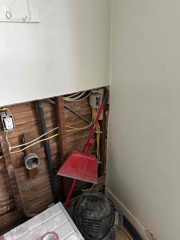 Completed electrical installation work for kitchen remodel including the relocation of refrigerator outlet, installation of new 220V outlet for dryer and 120V outlet for washer in stacked configuration. Installed six code-compliant GFI-protected countertop outlets on existing arc-faulted circuits, relocated gas range outlet, and wired new range hood. Toe kick heater installation pending arrival of unit.