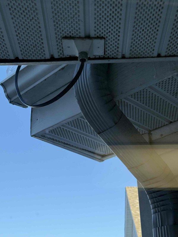 Performed diagnostic assessment of non-functional heat tape system on roof. Inspected electrical panel where multiple heat tape circuits (labeled 2-5) were identified and found to be energized. Verified power reaching junction boxes for the two non-operational zones flanking the front entry. Determined issue was not electrical in nature and advised management to contact their dedicated heat tape maintenance vendor for further resolution.