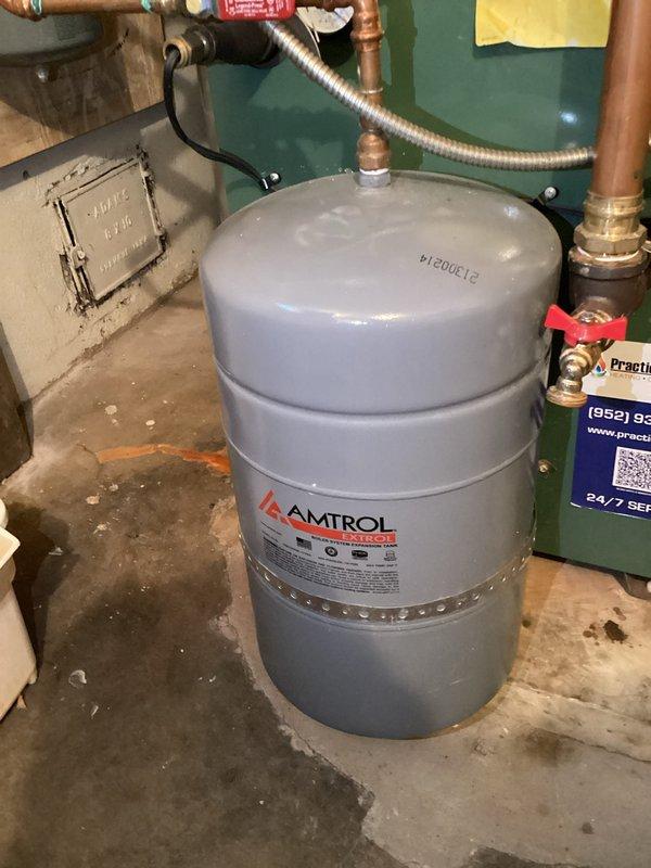 Responded to high pressure concerns in boiler system (25 psi) with observed water discharge from pressure relief valve. Inspection revealed corroded pressure relief valve and compromised Amtrol expansion tank. Diagnosed system overheating issues affecting upper floor temperature regulation. Provided customer with comprehensive solution recommendations including expansion tank replacement, air separator installation, and possible thermostat upgrade to resolve pressure fluctuations and improve temperature control.