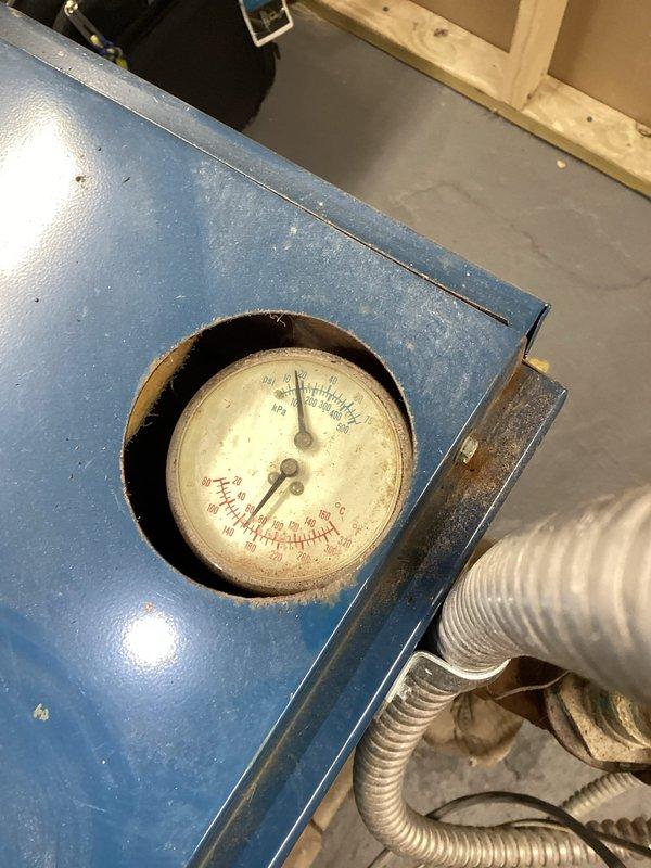 Diagnosed heating issue affecting second floor radiators where 3 of 5 radiators were not providing heat. Inspected boiler system and pressure gauge which showed suboptimal readings. Performed initial troubleshooting on the copper pipe network and valve system. Will return to properly drain and purge the entire system to restore full circulation to all upstairs radiators.