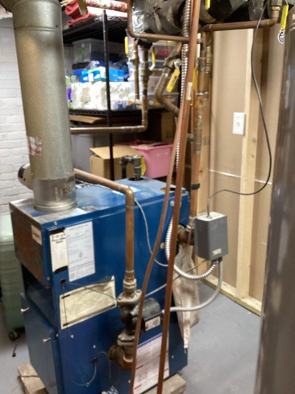 Diagnosed heating issue affecting second floor radiators where 3 of 5 radiators were not providing heat. Inspected boiler system and pressure gauge which showed suboptimal readings. Performed initial troubleshooting on the copper pipe network and valve system. Will return to properly drain and purge the entire system to restore full circulation to all upstairs radiators.