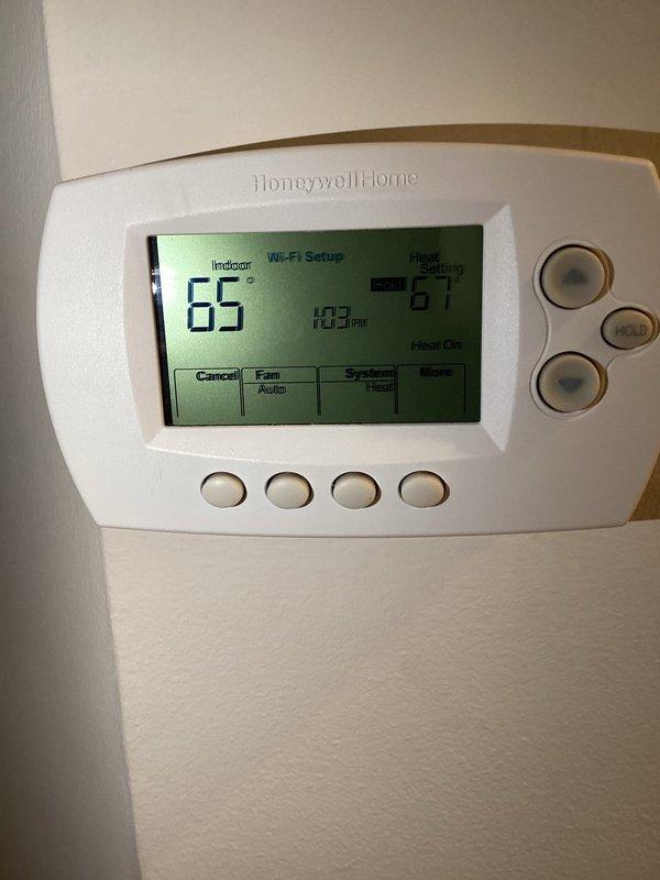 Responded to customer's complaint of furnace underperforming (set at 67°F but only reaching 64°F). Diagnostic testing revealed multiple component failures affecting system efficiency. Observed proper blue flame pattern through inspection port but insufficient heating capacity. Recommended and performed complete system replacement as repair of failing components would not restore proper functionality.