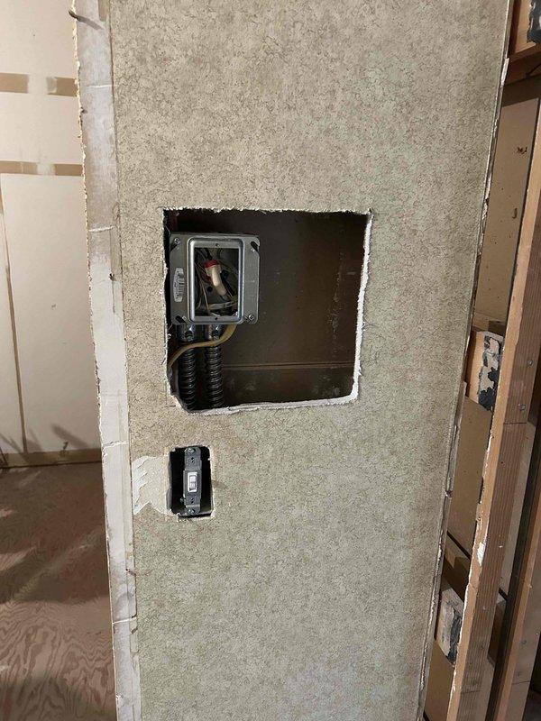 Completed master bathroom electrical renovation including installation of vanity sconces, ceiling lights, shower lighting, and GFCI outlets. Relocated vanity outlet to a dedicated circuit per code requirements. Installed and wired underfloor heating system with programmable thermostat and added a new bidet outlet. Wired exhaust fan with dual switch system featuring timer functionality for the fan operation.