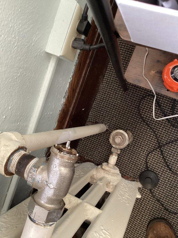 Responded to call regarding boiler communication issues and overheating. Inspected radiator components and verified thermostat functionality, which displayed 74°F in heat mode. Diagnosed communication failure between thermostat and boiler system causing temperature regulation problems. Unable to complete full diagnostic or repair as access to boiler was restricted; customer informed that technician will need direct access to boiler equipment for proper assessment and resolution.