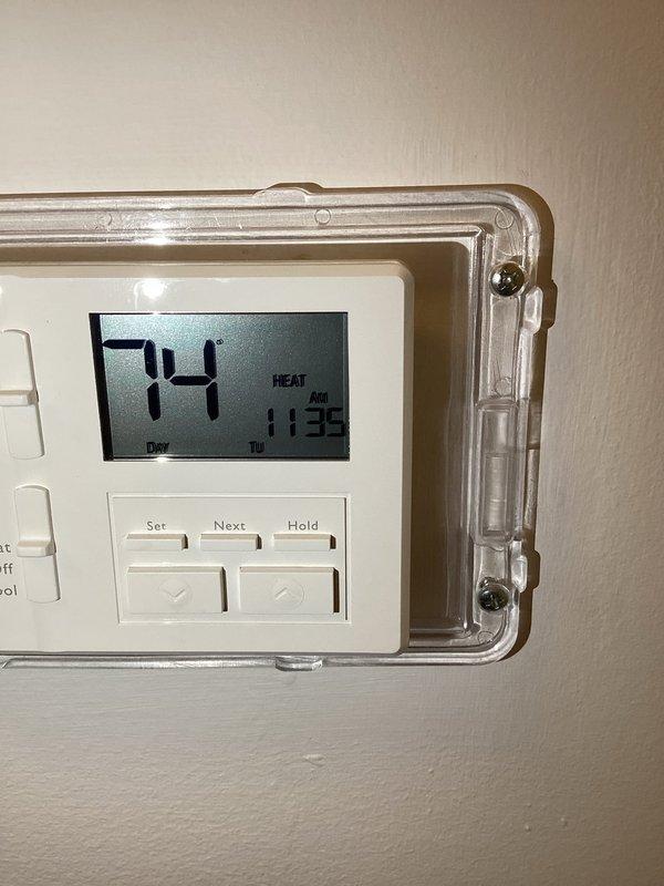 Responded to call regarding boiler communication issues and overheating. Inspected radiator components and verified thermostat functionality, which displayed 74°F in heat mode. Diagnosed communication failure between thermostat and boiler system causing temperature regulation problems. Unable to complete full diagnostic or repair as access to boiler was restricted; customer informed that technician will need direct access to boiler equipment for proper assessment and resolution.