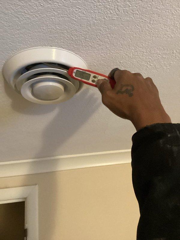 Responded to after-hours service call for mini split system showing error code and no heat upstairs - an ongoing issue previously serviced in July and October. Conducted diagnostic testing using handheld measurement device at ceiling registers and verified Daikin thermostat settings (set to heat mode at 69°F). Due to darkness and potential issues with air, moisture, or refrigerant levels, service was suspended and rescheduled for comprehensive troubleshooting.