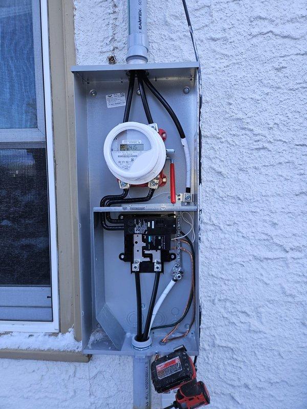 Successfully completed a 200 amp electrical service upgrade, installing a new outdoor meter enclosure with extended service mast to meet NEC clearance requirements. Replaced the existing panel with a new 200 amp 40-space main electrical panel in the unfinished basement, reconnecting all circuits with new breakers, and installed a whole home surge protective device along with proper grounding using two 8' ground rods and bonding to the water meter.