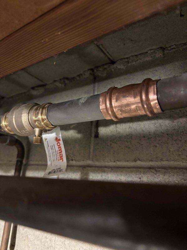 Responded to water leak service call at vacant property. Located and repaired multiple leak points including two angle stops and laundry faucet. Identified but deferred repairs on two shower cartridges/valve bodies and dishwasher pending further estimate. Successfully restored water service to property with partial leak remediation completed.